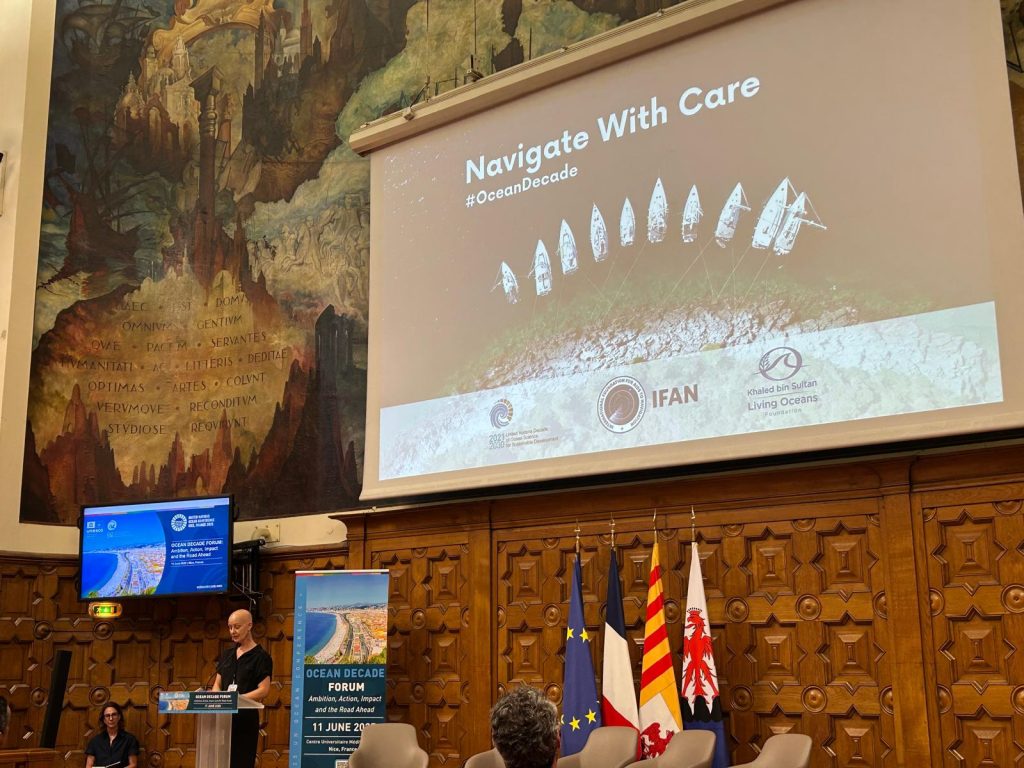 Francesca Pradelli IFAN launches Navigate with Care campaign in Nice during Ocean Decade forum, Francesca stands behind podium to speak